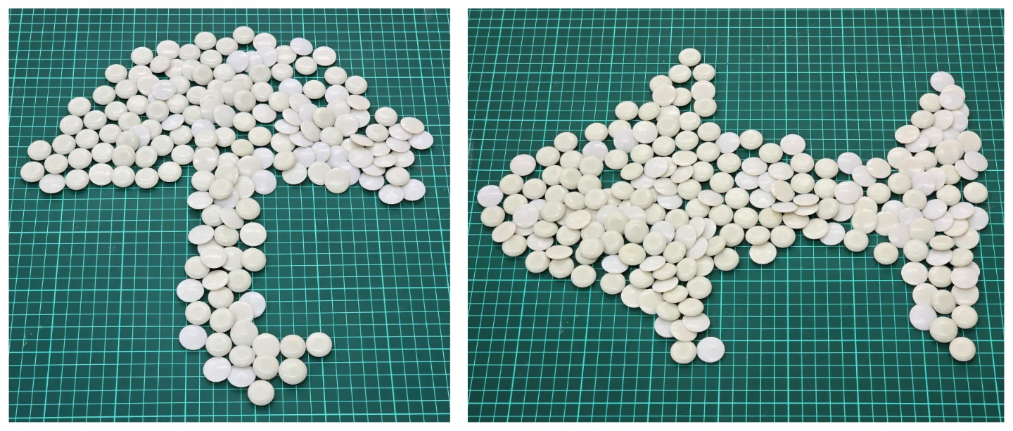 The Go pieces smooshed into two shapes. Left: An umbrella. Right: A fish... or maybe a shark?
